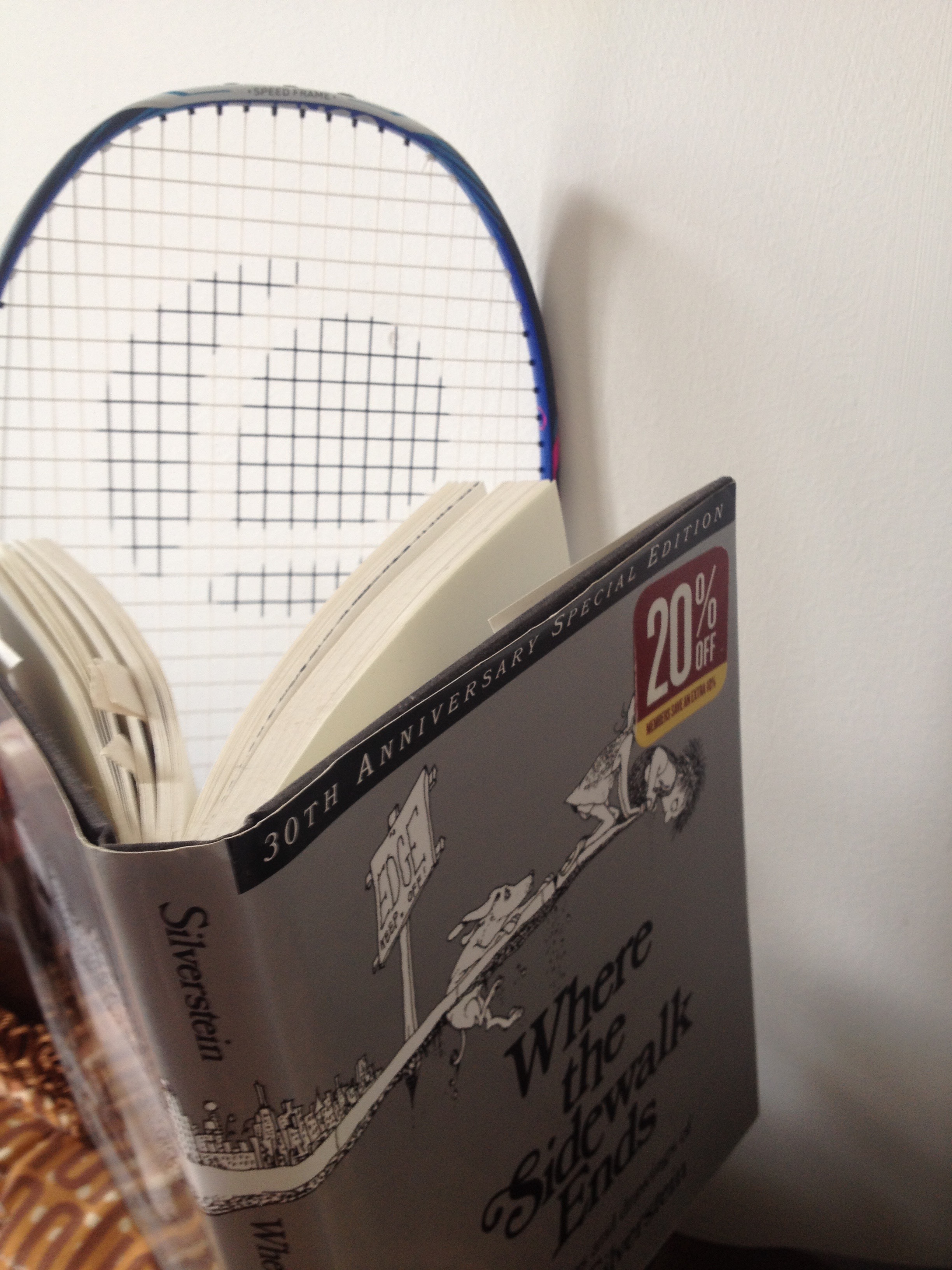 After a snack, my racket likes to read a little poetry to keep it's mind fresh. 