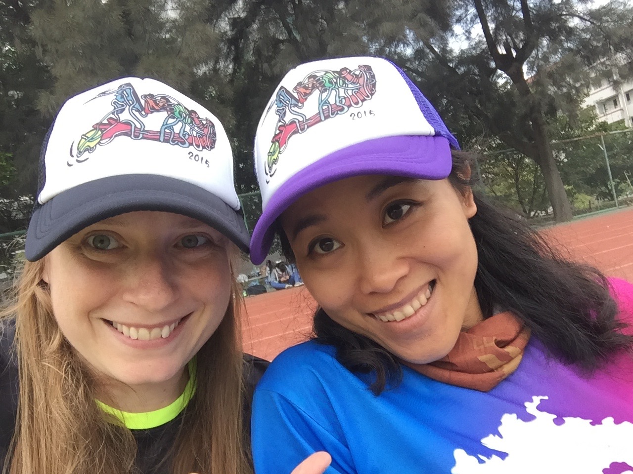 Me and Shulei, the female MVP, wearing our awards. It's a hat designed by one of the player. It says "Amoy" which is the old name of Xiamen, and has a hand throwing a frisbee. Stylish and functional is the Bailu way.