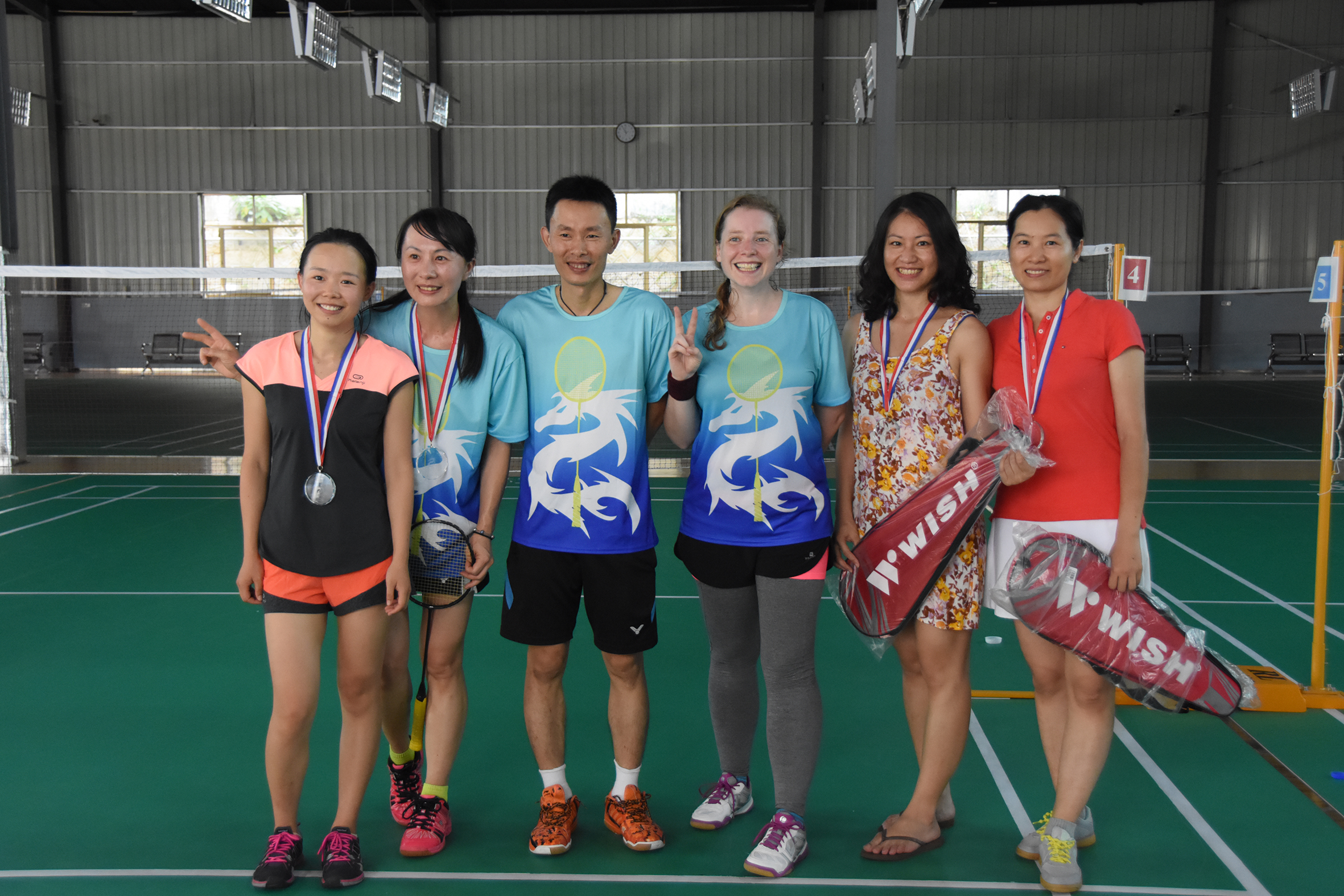 The whole thing took about four hours, and finally we had the awards ceremony. I had the medals made, but as an added bonus my coach has sponsorship from the Wish company, and the winners got a brand new racket! It's actually the racket I use, so I know it's a good deal. These are the winners and second place winners in the women's doubles. 