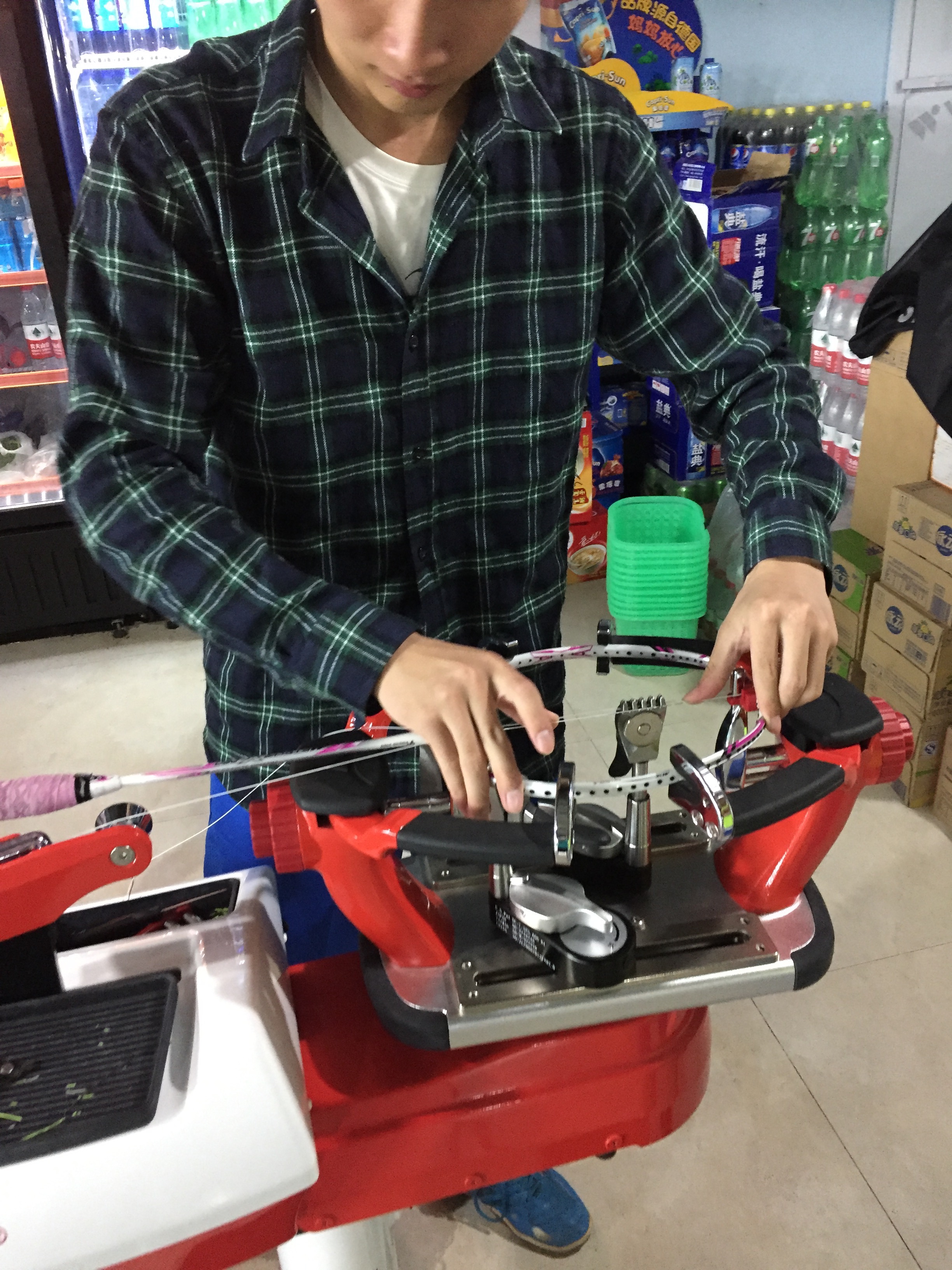 Now that I have a second home in the badminton court, my friends are the ones who re-string the rackets for me. I told him it was "precious cargo" and kept bugging him by taking pictures throughout. 