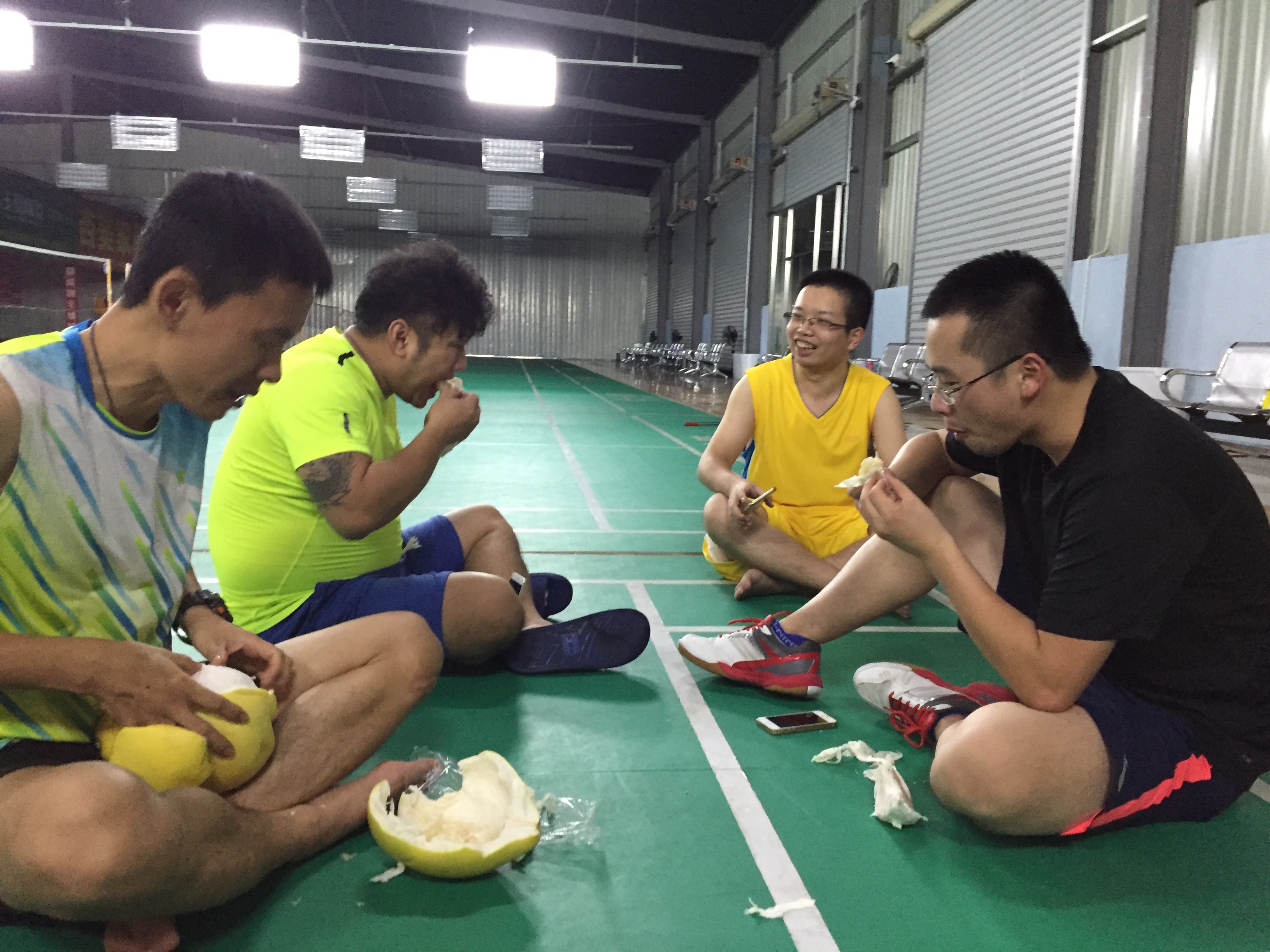 Sometimes we just plunk down right on the court and hang out. My coach brought out some pomelo fruit and proceeded to peel it with his hands. Total bad ass. 